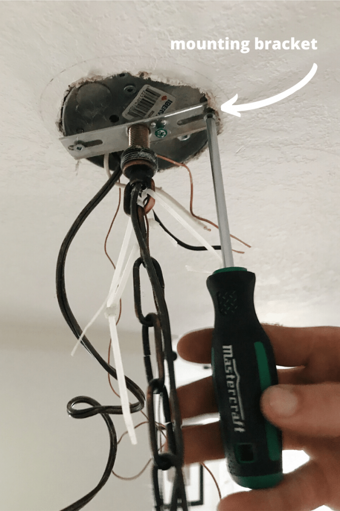 removing mounting bracket for old light fixture 
