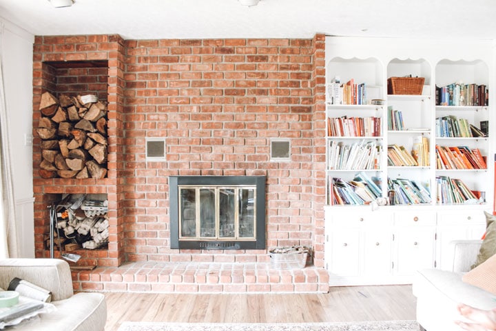 red brick fireplace and built-in bookcase 
